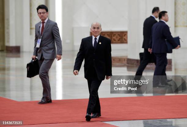 Cambodian King Norodom Sihamoni walks inside the Great Hall of the People before his meeting with Chinese President Xi Jinping on May 14, 2019 in...