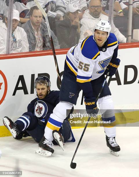 Bryan Little of the Winnipeg Jets looks up after a check from Colton Parayko of the St. Louis Blues in Game Five of the Western Conference First...