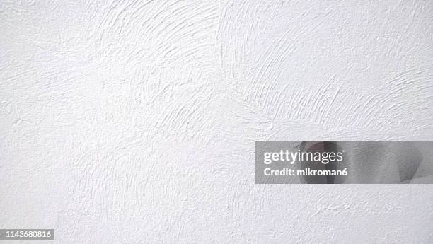 abstract background texture concrete or plaster hand made wall - wall fotografías e imágenes de stock