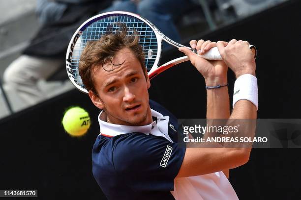 Russia's Daniil Medvedev returns the ball to Australia's Nick Kyrgios during their ATP Masters tournament tennis match at the Foro Italico in Rome on...