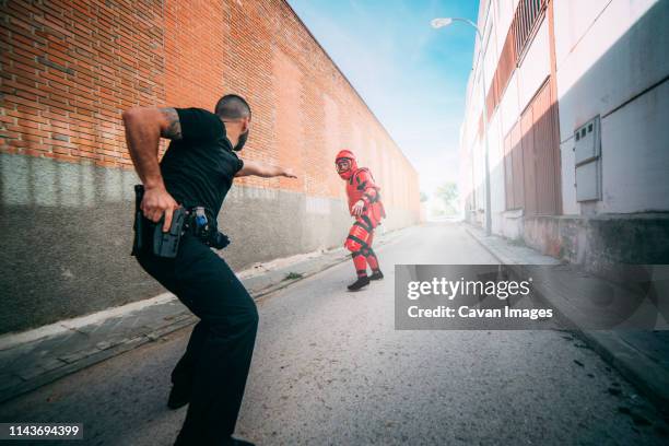 tactical police training. man with anti-shock clothing. - action force stock pictures, royalty-free photos & images