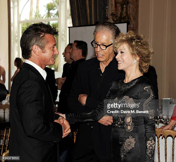 Actor Sean Penn, Richard Perry and actress Jane Fonda attend the Cinema For Peace inaugural Cannes dinner honoring Sean Penn for his charity work in...