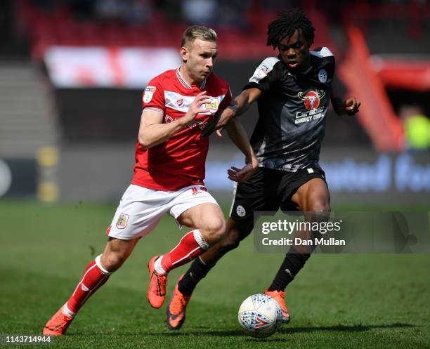 Andreas Weimann of Bristol City battles for possession with Ovie Ejaria of Reading during the Sky Bet Championship match between Bristol City and...