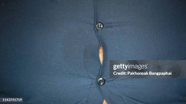 people with overweight ,overweight stomach , fat men and tight clothing. - too small stock pictures, royalty-free photos & images