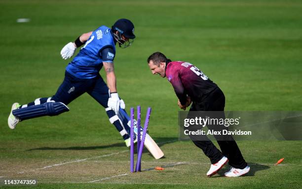 Roelof van der Merwe of Somerset runs out Darren Stevens of Kent during the Royal London One Day Cup match between Somerset and Kent at The Cooper...