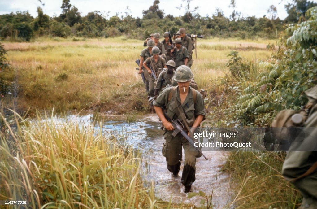 Army Troops Cross Stream