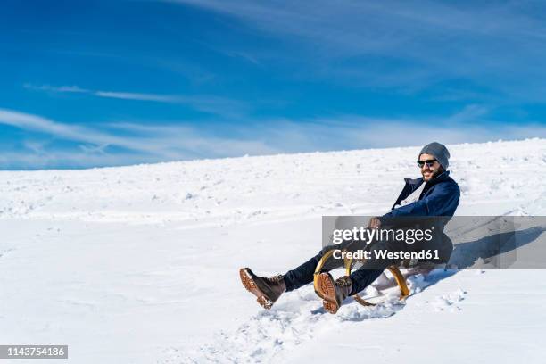 Man Riding Sled 7,582 Man Sledding Stock Photos, High-Res Pictures, and Images - Getty ...