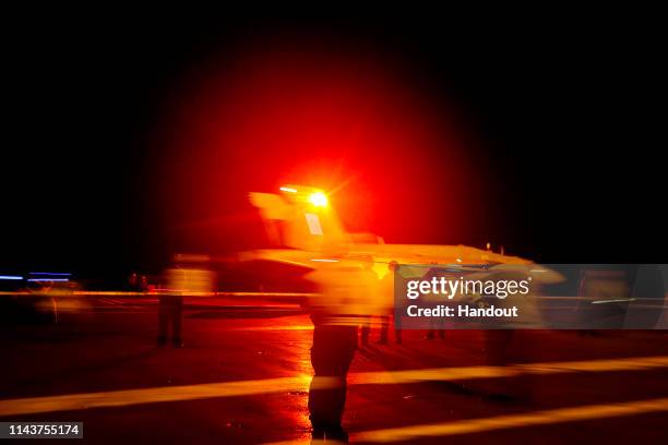 In this handout photo provided by the U.S. Navy, an F/A-18E Super Hornet from the "Sidewinders" of Strike Fighter Squadron 86 launches from the...