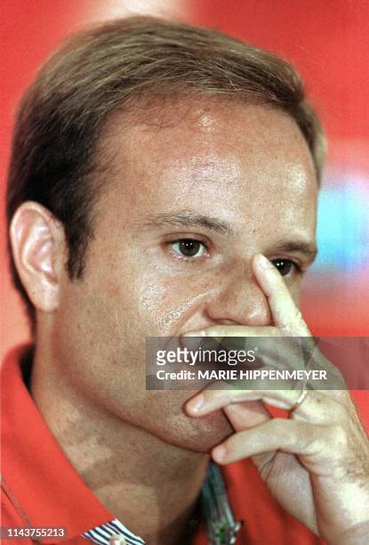 Brazilian piolot, Rubens Barrichello, listens to journalists' questions during a press conference in San Pablo 02 February, 2000. Barrichello is the...