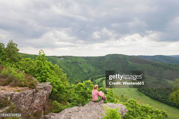 germany, north rhine-westphalia, eifel, nideggen region, hiker enjoying view from eugenienstein to high fens - eifel nature park - eifel stock pictures, royalty-free photos & images