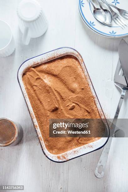 tiramisu with coconut and cashew cream in casserole, from above - tiramisu stock-fotos und bilder