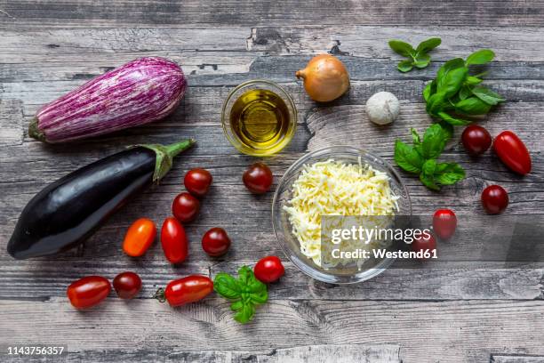 various ingredients for aubergine-pizza, low carb - grated stock pictures, royalty-free photos & images