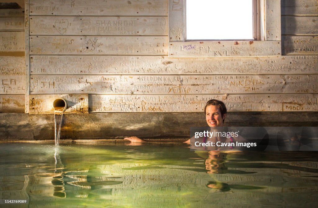 Lab Indoor Hot Spring A Woman Soaks In An Indoor Hot Spring In An Old Barn Building High-Res ...