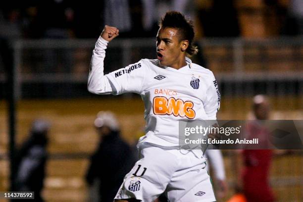 Neymar of Santos celebrates a scored goal against Once Caldas during a match as part of the Santander Libertadores Cup 2011 at Pacaembu stadium on...