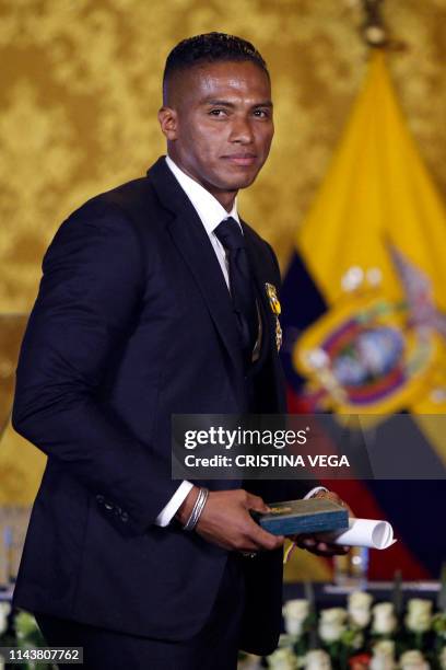 Ex-Manchester United Ecuadorean footballer Luis Antonio Valencia poses after being decorated by Ecuadorean President Lenin Moreno with the National...