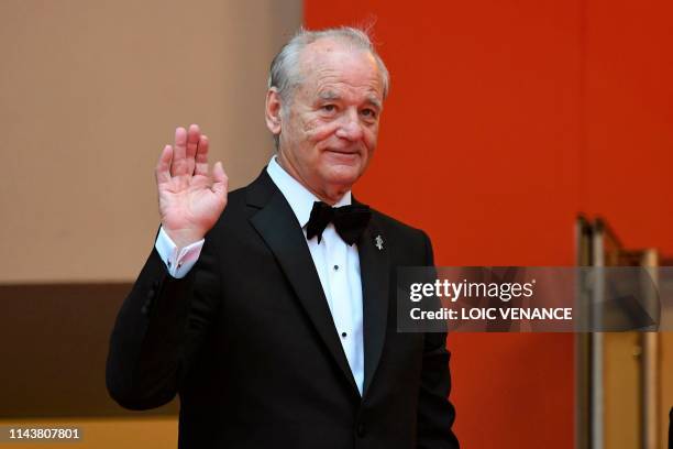 Actor Bill Murray waves as he arrives for the screening of the film "The Dead Don't Die" during the 72nd edition of the Cannes Film Festival in...