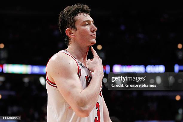 Blood drips from the neck of Omer Asik of the Chicago Bulls after he drew contact against the Miami Heat in Game Two of the Eastern Conference Finals...