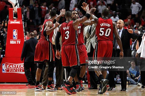 Dwyane Wade, LeBron James and Joel Anthony of the Miami Heat celebrate after they won 85-75 against the Chicago Bulls in Game Two of the Eastern...