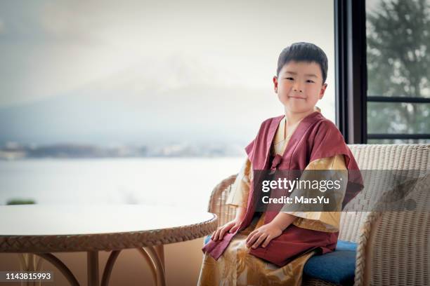 boy sitting in front of mt.fuji - ryokan stock pictures, royalty-free photos & images
