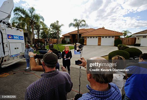 Member of the news media do their stand up outside the home of Mildred Patricia Baena, former household staff member who mothered a child with former...