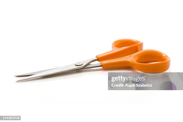 a pair of scissors with a orange handle - scissors 個照片及圖片檔