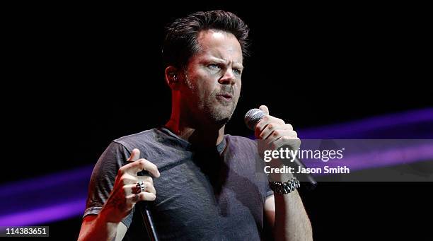 American country music artist Gary Allan performs for fans during the NASCAR Rev'd Up Concert at the NASCAR Hall of Fame on May 18, 2011 in...