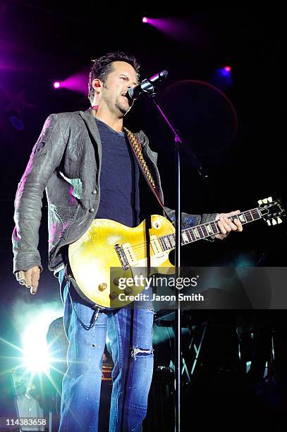 American country music artist Gary Allan performs for fans during the NASCAR Rev'd Up Concert at the NASCAR Hall of Fame on May 18, 2011 in...