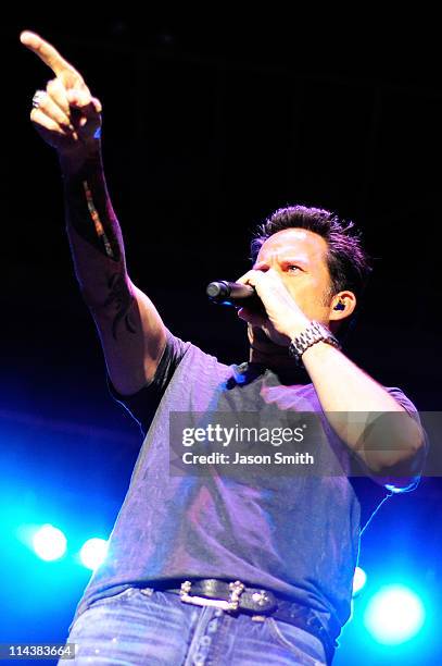 American country music artist Gary Allan performs for fans during the NASCAR Rev'd Up Concert at the NASCAR Hall of Fame on May 18, 2011 in...