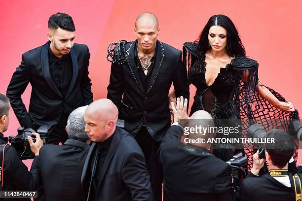 Adam Abaida Atarshi, US model Jeremy Meeks and Andreea Sasu arrive for the screening of the film "The Dead Don't Die" during the 72nd edition of the...