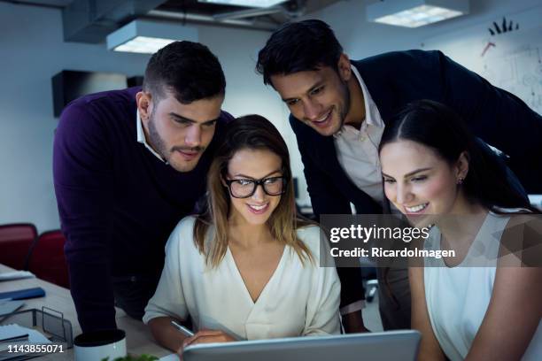 teamwork in the office - latin script stock pictures, royalty-free photos & images