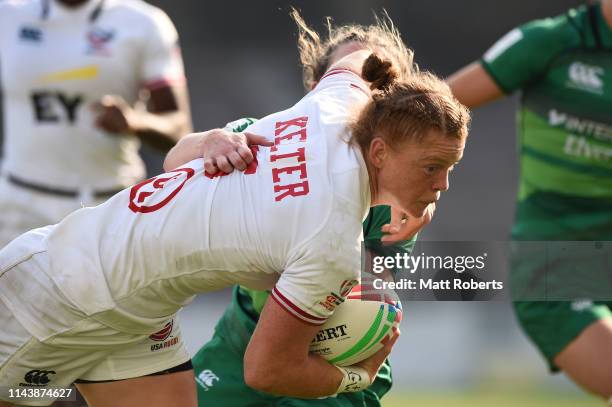 Alev Kelter of USA takes on the defence and scores a try during the pool match between USA and Ireland on day one of the HSBC Women's Rugby Sevens...