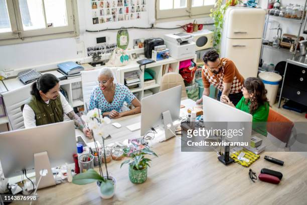 business executives working on computers at desk - disability collection stock pictures, royalty-free photos & images