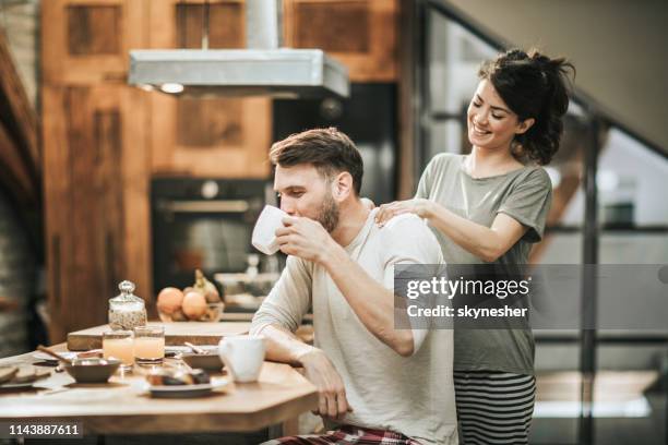 let me give you a back massage honey! - pyjamas stock pictures, royalty-free photos & images