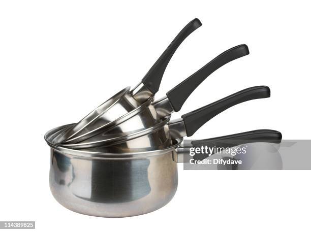 stack of stainless steel saucepans in different sizes - pan keukengereedschap stockfoto's en -beelden