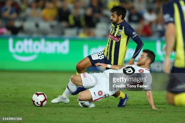 Alexander Baumjohann of the Western Sydney Wanderers contests the ball with Jem Karacan of the Central Coast Mariners during the round 26 A-League...