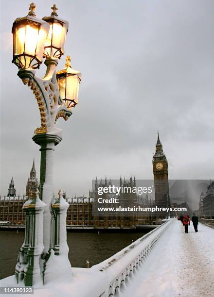 wintry big ben in  snow - london winter stock pictures, royalty-free photos & images