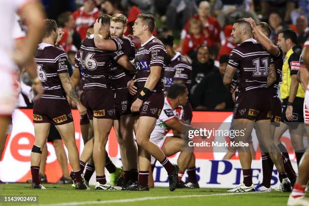 Brad Parker of the Sea Eagles celebrates with his team mates after scoring a try during the round 6 NRL match between the Dragons and the Sea Eagles...