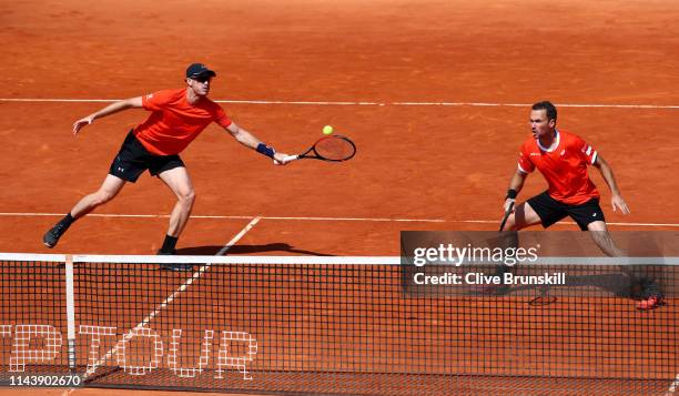 Jamie Murray of Great Britain and Bruno Soares of Brazil in action against Robin Haase and Wesley Koolhof of the Netherlands in their semifinal match...