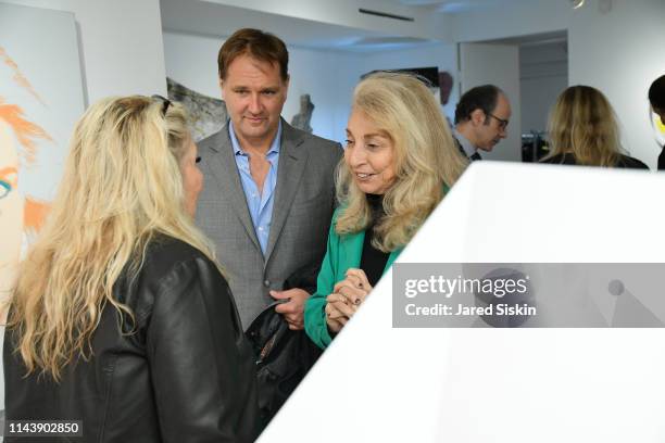 Jane Holzer, Nicholas Varney and Eleanora Kennedy attend Double Vision Curated By Jane Holzer at Leila Heller Gallery on May 13, 2019 in New York...