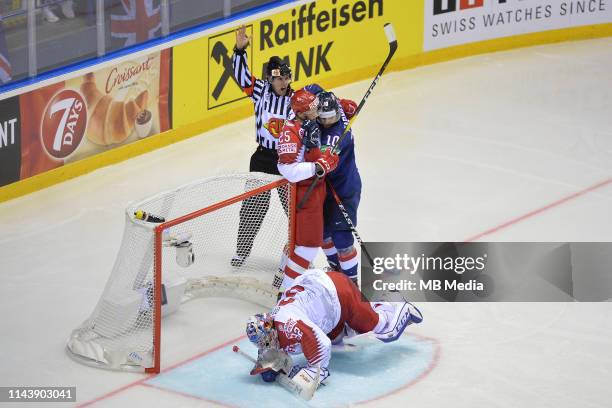 S Robert Farmer and Denmark's Oliver Lauridsen come together during the 2019 IIHF Ice Hockey World Championship Slovakia group A game between Great...