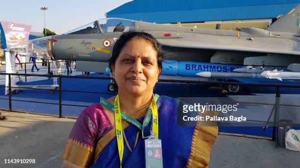 Aerospace scientist Tessy Thomas, also dubbed Indian missile woman she was heading India's", stands in front of India's Light Combat Aircraft or...