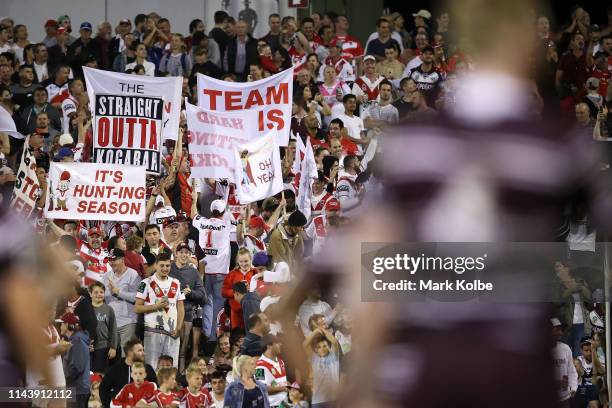 Dragons supporters cheer during the round 6 NRL match between the Dragons and the Sea Eagles at WIN Stadium on April 20, 2019 in Wollongong,...