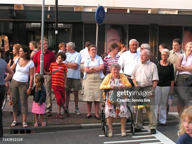 crowd of people waiting for a parade to pass by - utrecht stock pictures, royalty-free photos & images
