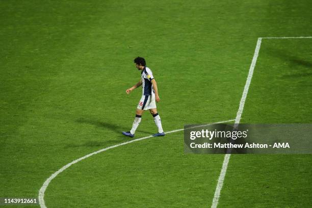 Dejected Ahmed Hegazy of West Bromwich Albion walks back after missing his penalty during the Sky Bet Championship Play-off Semi Final Second Leg...