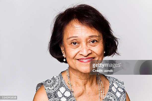 portrait of happy senior woman with short brown hair - asian woman short hair stock pictures, royalty-free photos & images