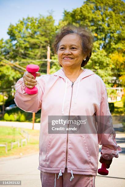 senior fitness - tracksuit stock pictures, royalty-free photos & images