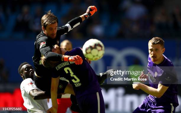 Martin Maennel, goalkeeper of Aue makes a save against Khaled Narey of Hamburg the Second Bundesliga match between Hamburger SV and FC Erzgebirge Aue...