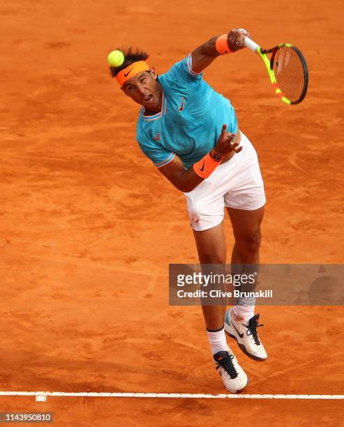 Rafael Nadal of Spain serves against Fabio Fognini of Italy in their semifinal match during day seven of the Rolex Monte-Carlo Masters at Monte-Carlo...