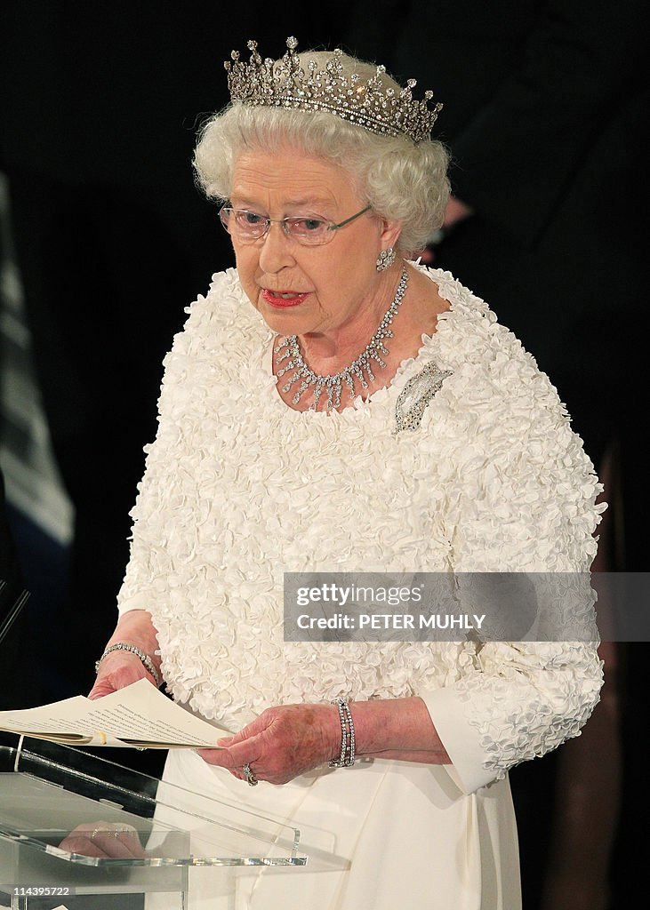 Britain's Queen Elizabeth II speaks to g