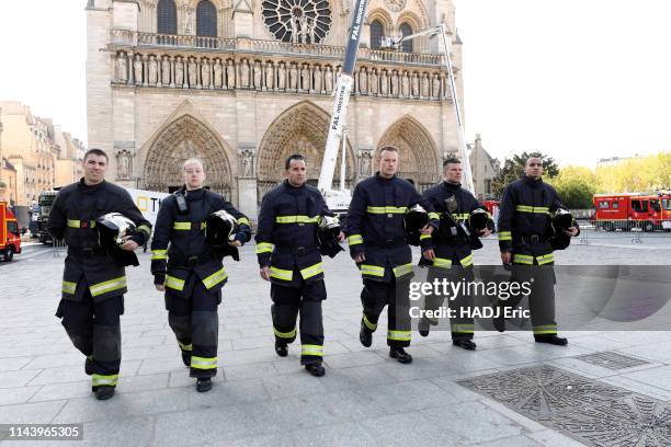 The firefighters of Notre-Dame are photographed for Paris Match in front of Notre-Dame de Paris on April 19 Marc, Jerome, Christophe Myriam, Benjamin...